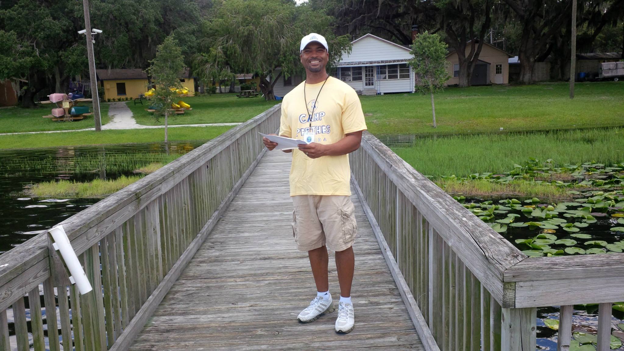 Founder Earl Cole at the very first Camp Perthes, on the dock in Florida