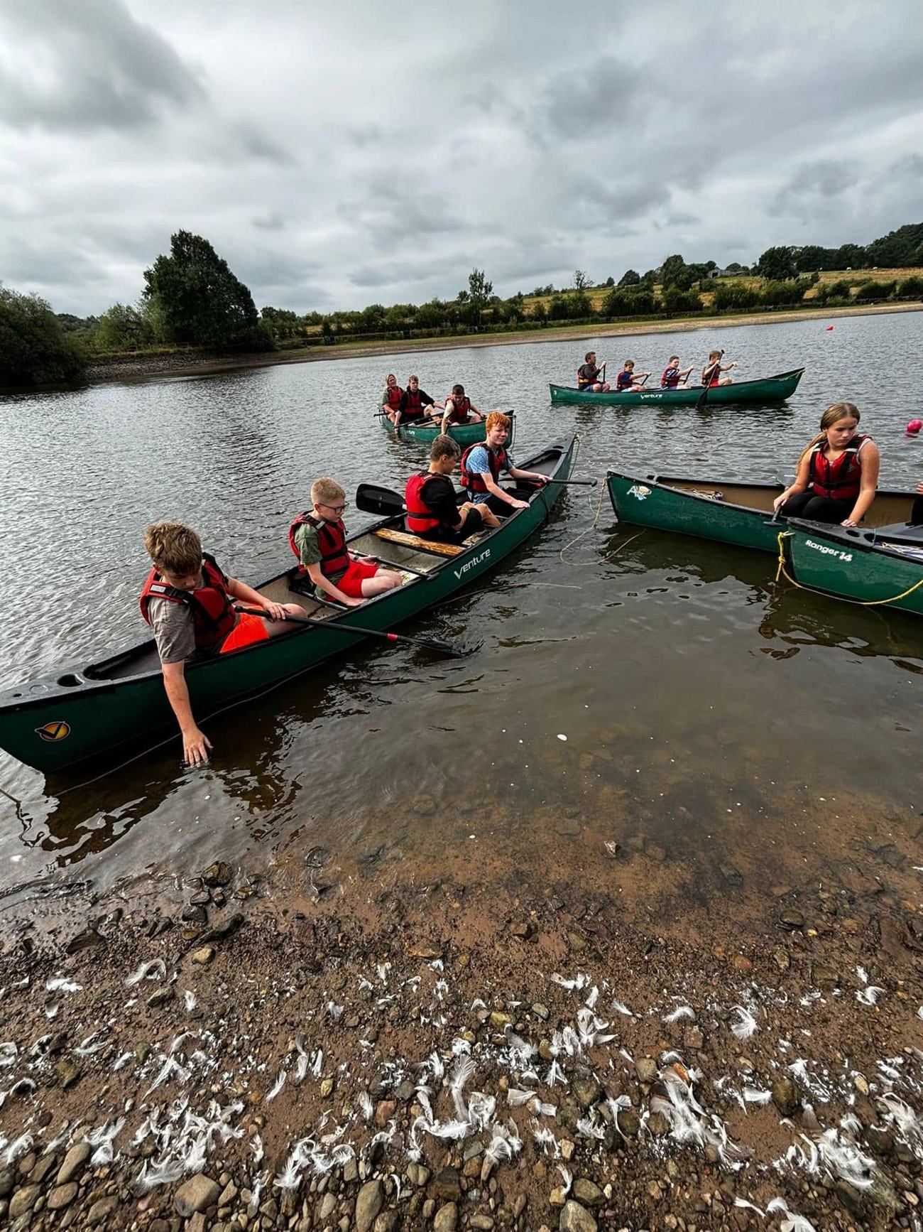 Campers canoeing together on the lake