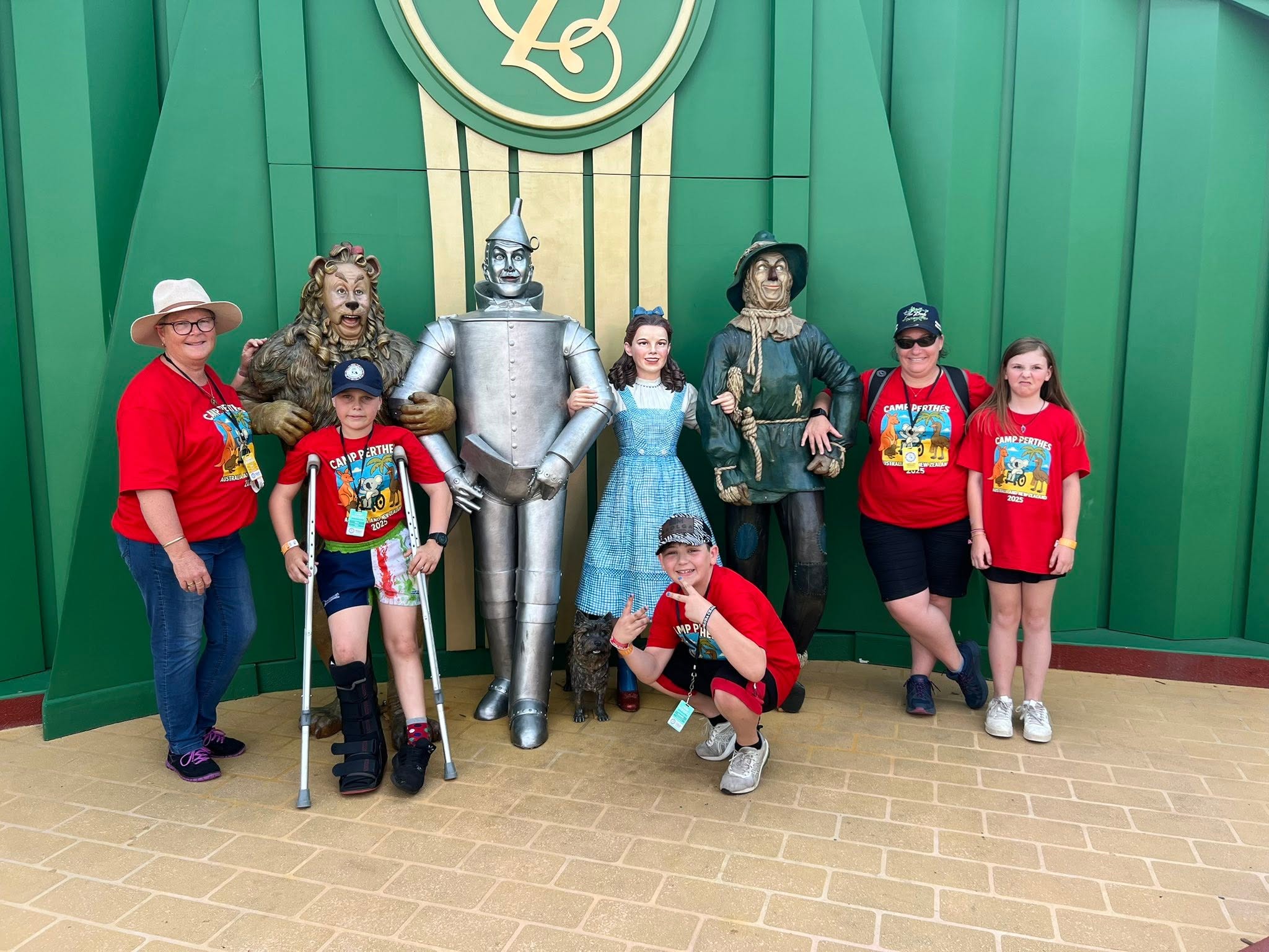 Campers posing with Wizard of Oz characters on a day out