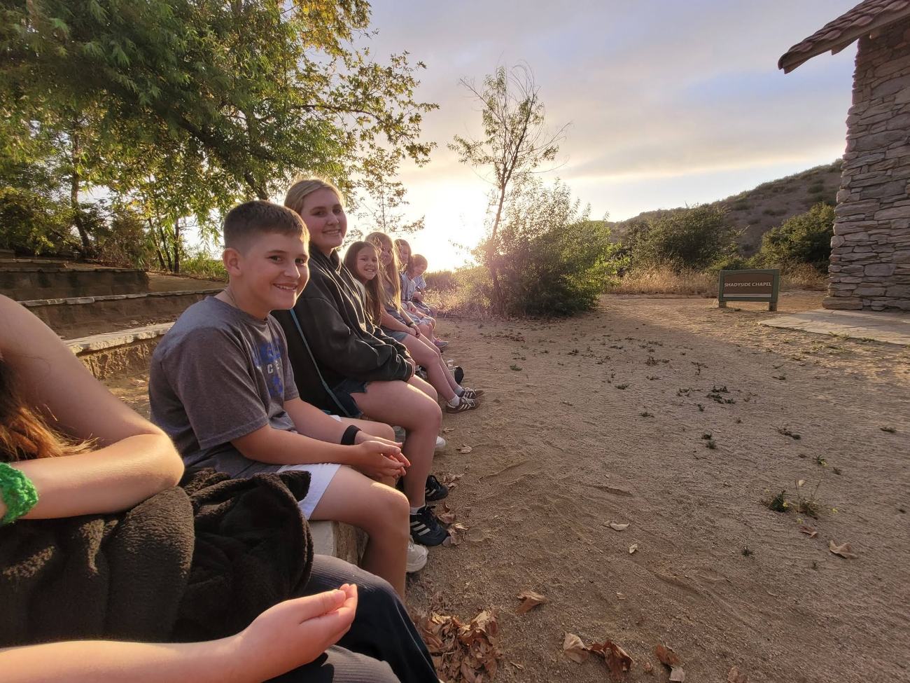 Campers together at golden hour
