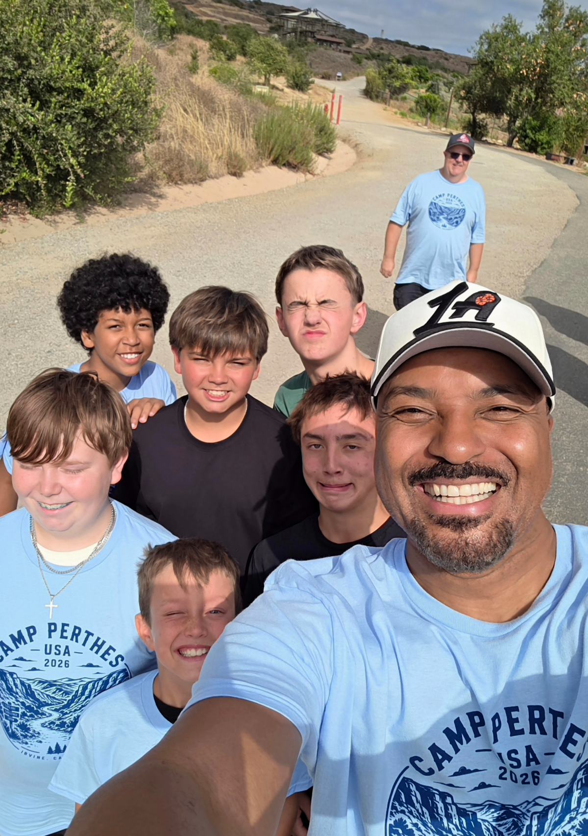 Earl Cole taking a selfie with a group of campers at Camp Perthes USA