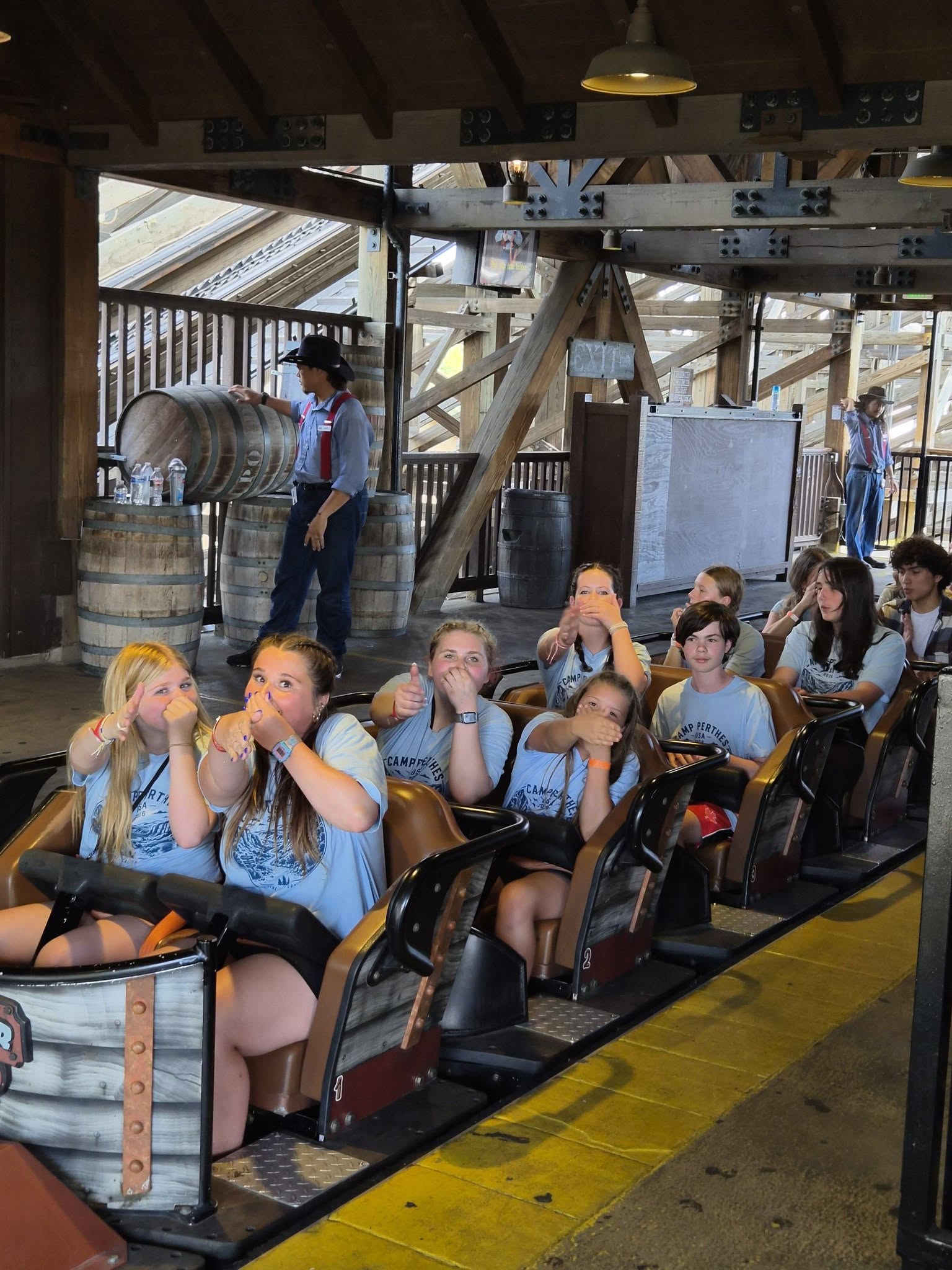 Perthes campers thrilled and giving thumbs up on a roller coaster